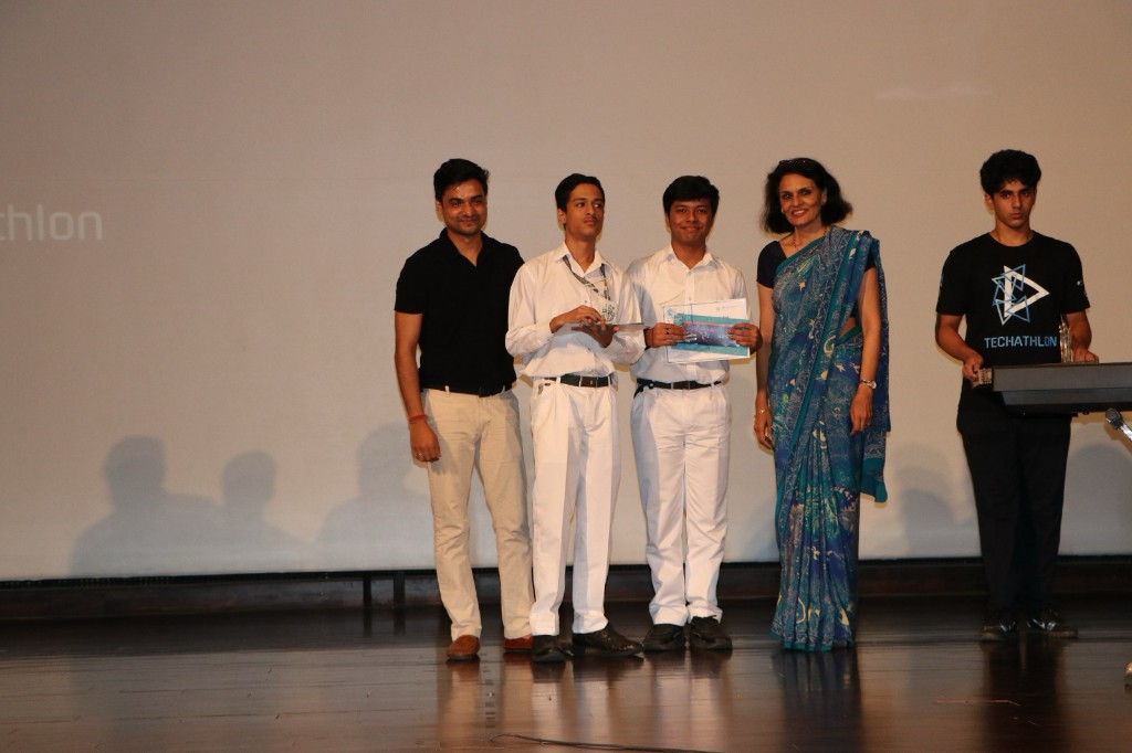 Students receiving certificates on stage during the Techathlon awards ceremony